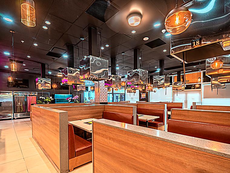 KOSOO Korean BBQ Coquitlam dining room with booths and overhead grill vents numbered to 18