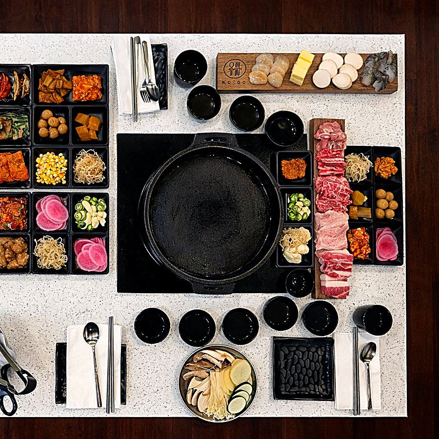 KOSOO all-you-can-eat spread — assorted meats, seafood and banchan side dishes